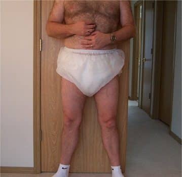 Man Wearing The baby adult diaper and touching her stomach