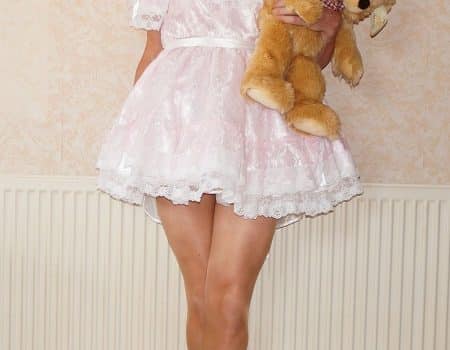 Cute Little Girl With Teddy Bear At Home