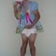 Boy wearing the baby adult diaper and sissy dress